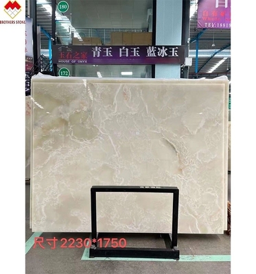 แผ่นมาร์บอร์มออนิกซ์สีขาวแบบ Royal White Onyx ที่มีแสงเบื้องหลังสําหรับโต๊ะที่สามารถปรับแต่งได้